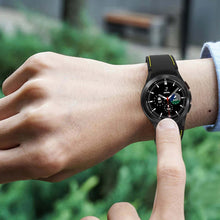 Load image into Gallery viewer, Person wearing Samsung Galaxy Watch 4 Classic with 20mm silicone sports bracelet, highlighting style and functionality.