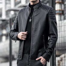 Load image into Gallery viewer, Men's vegan leather motorcycle jacket in black, perfect for sleek style and protection on rides, featuring quilted shoulders and zippered pockets.