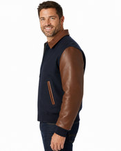 Cargar imagen en el visor de la galería, REED Men's Executive Varsity Jacket with cowhide leather sleeves and wool body, union-made in the USA, worn by a model.