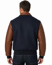 Cargar imagen en el visor de la galería, REED Men's Executive Varsity Jacket with cowhide leather sleeves and wool body, union-made in the USA, worn by a model.