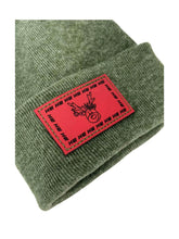 Cargar imagen en el visor de la galería, Reindeer Limited Edition Christmas Beanie in festive green knit with red patch, showcasing Haakwear’s HW H-Stitch design.