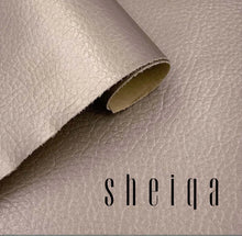 Load image into Gallery viewer, Close-up of textured leather repair fabric with brand logo sheiqa, showcasing premium material for restoring leather items.
