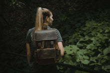 Load image into Gallery viewer, The Hagen Backpack | Vintage Leather Backpack on person in natural forest setting
