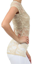 Load image into Gallery viewer, Side view of a woman wearing a stretch floral lace cap sleeve tunic tee, showcasing the sheer lace detail and slim fit.
