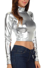Charger l'image dans la galerie, Metallic liquid mock neck turtleneck crop top, long sleeve, shining silver color, modeled with blue jeans, made in USA.