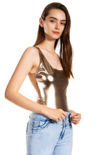 Load image into Gallery viewer, Woman wearing a metallic gymnastic leotard top with jeans, highlighting the shiny material and snug fit. Made in USA.