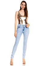 Load image into Gallery viewer, Woman wearing a metallic bodysuit paired with light blue jeans, showcasing a stylish, modern fashion look.
