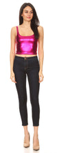 Charger l'image dans la galerie, Woman wearing a shiny pink sleeveless metallic crop top with skinny jeans, showcasing club fashion style.