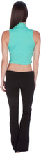 Load image into Gallery viewer, Back view of woman wearing a teal mock neck sleeveless turtleneck crop top paired with black pants.