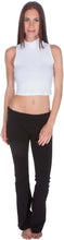 Load image into Gallery viewer, Woman wearing a white mock neck sleeveless crop top and black pants, showcasing stylish casual fashion.