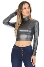 Load image into Gallery viewer, Model wearing metallic matte liquid mock neck turtleneck long sleeve crop top, made in USA, paired with dark blue high-waisted jeans.