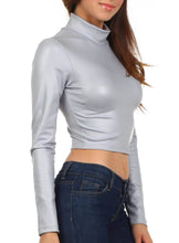 Load image into Gallery viewer, Model wearing matte liquid mock neck turtleneck long sleeve crop top in silver, paired with high-waisted jeans, side view