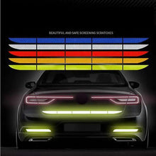 Load image into Gallery viewer, Reflective car wheel hub stripes for enhanced safety and visibility, shown in red, blue, and yellow colors, on rear of vehicle.