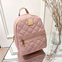 Load image into Gallery viewer, Pink mini backpack crossbody bag made from PU vegan leather, featuring a quilted design. Stylish and functional accessory for women.