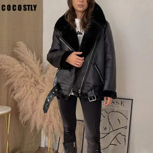 Load image into Gallery viewer, Woman wearing black faux leather fur coat with zipper closure, showcasing elegant and warm winter fashion, vegan-friendly design.