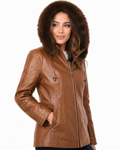 Load image into Gallery viewer, Woman wearing a brown leather jacket with fur hood on a white background