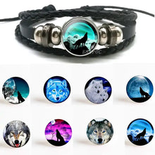Load image into Gallery viewer, Handmade leather wolf bracelet with full moon design, featuring intricate wolf imagery and premium quality craftsmanship.