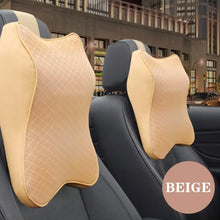 Load image into Gallery viewer, Beige leather memory foam car pillows on car seats, offering ergonomic neck support and enhancing comfort during drives.
