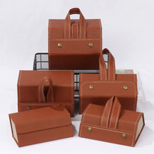 Cargar imagen en el visor de la galería, Brown vegan leather eyeglasses storage cases with multiple slots, featuring a sleek design and convenient handles.