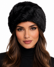 Charger l'image dans la galerie, A close-up of a woman wearing a black faux fur ushanka hat, shown against a plain white background.