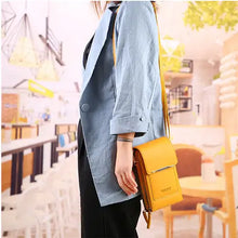 Load image into Gallery viewer, Stylish woman wearing a blue coat with a 2-in-1 yellow leather bag in a chic indoor setting.