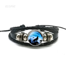Load image into Gallery viewer, Handmade leather bracelet with wolf and moon design, showcasing high-quality craftsmanship and premium materials for a stylish accessory.