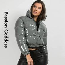 Load image into Gallery viewer, Woman wearing shiny gray PU leather winter jacket from Passion Goddess collection, showcasing chic and cozy style.