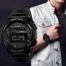 Load image into Gallery viewer, Men's digital LED watch with 12/24 hour display and luminous mirror, worn on a stylish individual's wrist, perfect for modern lifestyles.