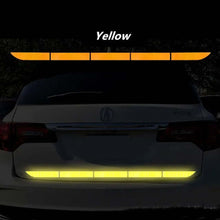 Load image into Gallery viewer, Yellow reflective tape on a car's rear bumper for enhanced road safety and visibility in low-light conditions.