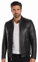 Load image into Gallery viewer, A man viewed from the back wearing a black leather jacket and black pants against a plain white background.