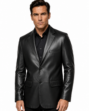 Charger l'image dans la galerie, A man wearing a black leather blazer over a black button-down shirt, photographed against a solid white background.