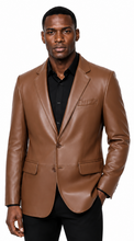Charger l'image dans la galerie, A man wearing a brown real -leather blazer over a black collared shirt and black pants, standing against a plain white background.