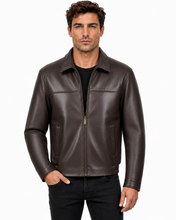 Charger l'image dans la galerie, A man wearing a dark brown leather jacket over a black shirt and black pants, standing against a plain white background.