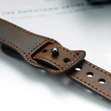 Load image into Gallery viewer, Close-up of a brown leather watch band showcasing elegant craftsmanship and classic design.