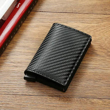 Load image into Gallery viewer, RFID Black Magic Trifold Vegan Leather Slim Mini Wallet on a Wooden Surface