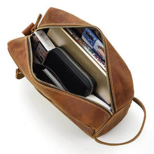 Load image into Gallery viewer, The Wanderer Toiletry Bag | Genuine Leather Toiletry Bag with open view showing spacious compartments filled with travel essentials.