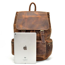 Load image into Gallery viewer, The Hagen Backpack | Vintage Leather Backpack with tablet for size comparison, showcasing genuine cowhide leather and spacious design.