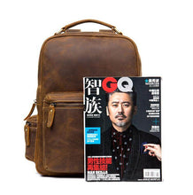 Load image into Gallery viewer, The Langley Backpack | Genuine Vintage Leather Backpack shown alongside a magazine for size reference.