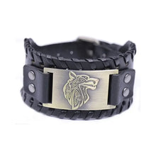 Load image into Gallery viewer, Vintage wide leather woven bracelet with wolf head centerpiece, symbolizing strength and independence.