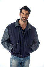Load image into Gallery viewer, Man wearing a REED leather varsity bomber jacket, showcasing top grain leather sleeves and collar, made in USA.