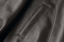 Load image into Gallery viewer, Close-up of genuine leather texture on REED Men's American Style Bomber Jacket, showcasing sleek and durable design.