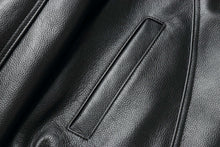 Load image into Gallery viewer, Close-up of REED Men's American Style Bomber Genuine Leather Jacket showcasing black leather texture and sleek stitching details.