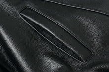Load image into Gallery viewer, Close-up of genuine leather texture on a REED Men's American Style Bomber Jacket, highlighting its luxurious and durable quality.
