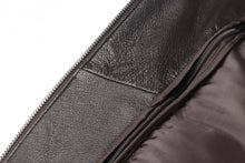 Load image into Gallery viewer, Close-up of REED Men's American Style Bomber Jacket in genuine leather, featuring a detailed view of the interior lining and zipper.