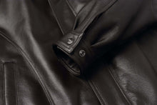 Load image into Gallery viewer, Close-up of REED Men's American Style Bomber Jacket in genuine leather showcasing luxurious texture and quality craftsmanship.