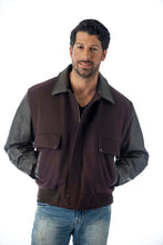 Load image into Gallery viewer, Men's leather varsity bomber jacket by REED, made in USA, featuring wool body and leather sleeves, worn by model with hands in pockets.