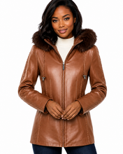 Load image into Gallery viewer, Woman wearing a brown leather jacket with fur hood on a white background