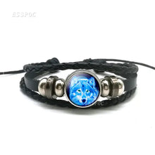 Load image into Gallery viewer, Handmade leather wolf bracelet with full moon design, featuring high-quality craftsmanship and braided detail for a wild style.