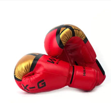 Load image into Gallery viewer, Red and gold kickboxing gloves for adults made from premium PU leather, featuring an adjustable wrist strap and breathable design.