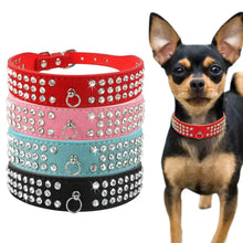 Load image into Gallery viewer, Chihuahua wearing adjustable leather bowknot collar with sparkling rhinestones, next to stacked studded collars in red, pink, blue, and black.